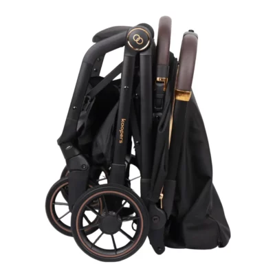 Koopers Eezi stroller folded compactly, demonstrating its easy-to-store and portable nature for busy parents in Malaysia.