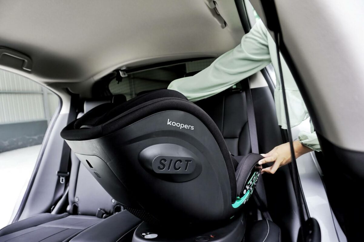 Installing the Koopers Armour 360 baby car seat with Side Impact Cushion Technology for added protection.