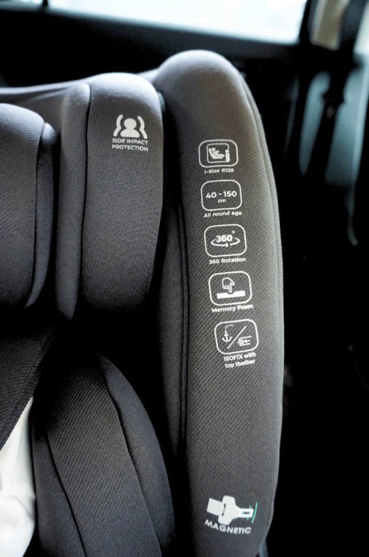 Close-up of the Koopers Armour 360 car seat showing key features like i-Size certification and 360° rotation