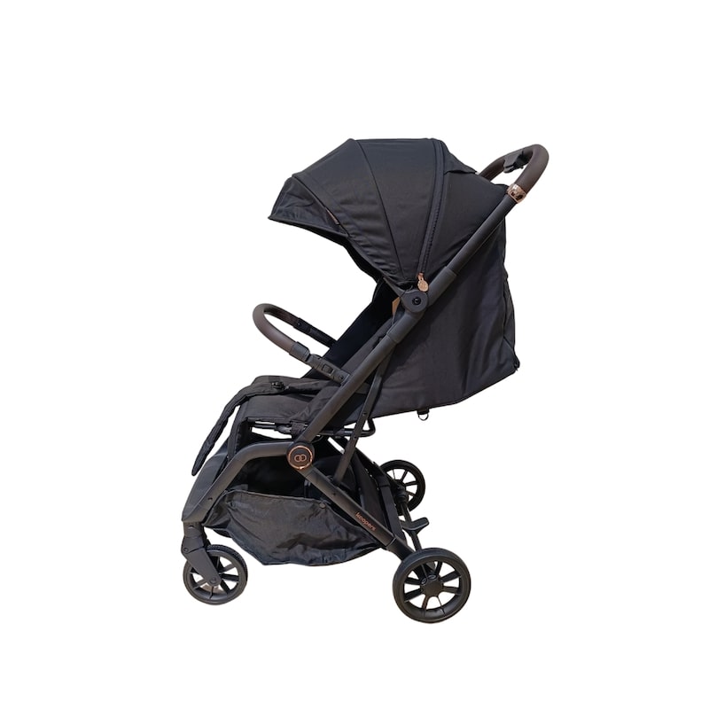 choosing-the-right-stroller-and-car-seat-for-your-newborn-5 Side profile of Koopers Eezi stroller in black, featuring NanoFibre fabric and travel-friendly foldable frame.