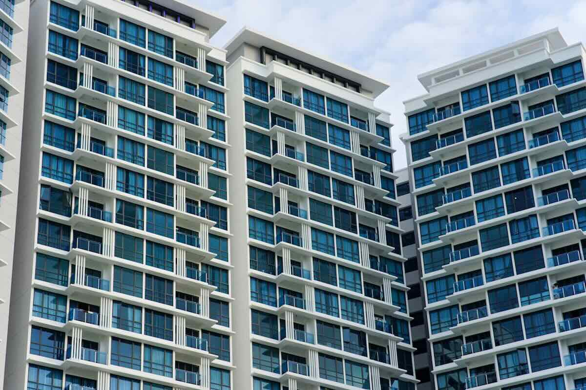baby-cot-vs-travel-cot-which-is-better-in-malaysia-2 Modern high-rise apartment buildings in Malaysia, illustrating space constraints for baby cot setup