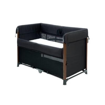can-you-use-a-playpen-as-a-baby-cot-3 Koopers Airi Flexi Cot in black with wooden accents, versatile playpen baby cot featuring mesh sides for airflow and foldable design, ideal for safe full-time sleep in small Malaysian apartments.