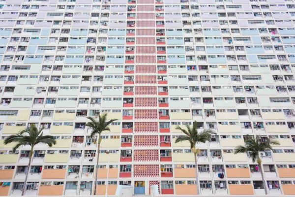 what-to-look-for-in-baby-cot-that-grows-with-your-baby-3 Colorful high-rise apartment block in Malaysia, representing urban living and the need for compact baby furniture in limited spaces.