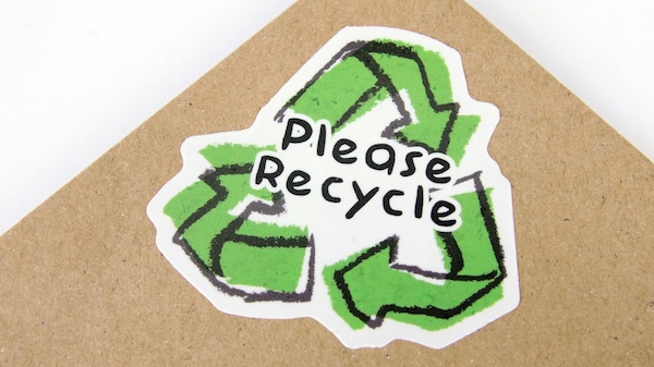why-baby-car-seat-expiry-date-matters-5 Please recycle sticker on cardboard, representing responsible disposal of expired baby car seats and strollers.